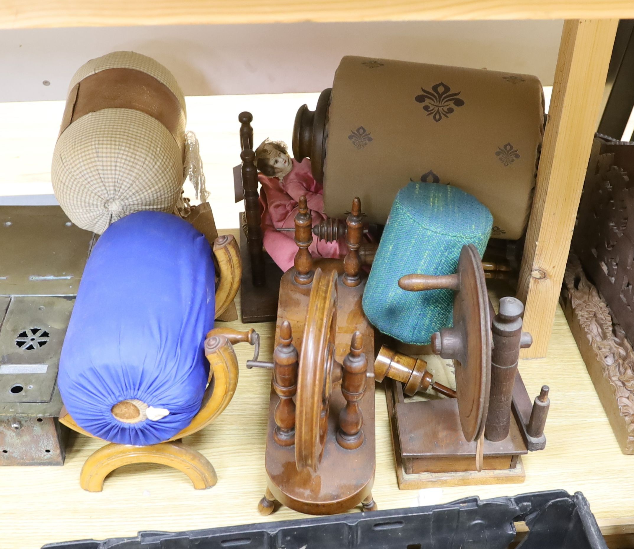 Two model spinning wheels, lace-maker’s pillows, bobbins, pillows etc